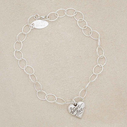 Sterling silver Brave Love emblem bracelet with a matte brushed finish