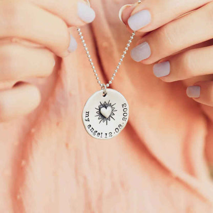 girl holding a Bursting Heart Necklace