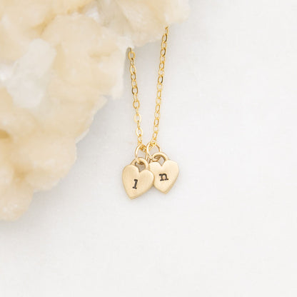 Cherished hearts initials necklace handcrafted in 10k yellow gold including two customizable charms