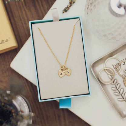 Cherished hearts initials necklace handcrafted in 14k yellow gold including two customizable charms