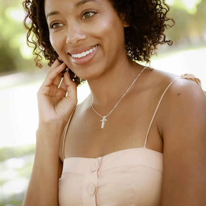 woman wearing sterling silver child of faith cross necklace