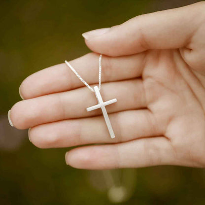 woman wearing sterling silver child of faith cross necklace