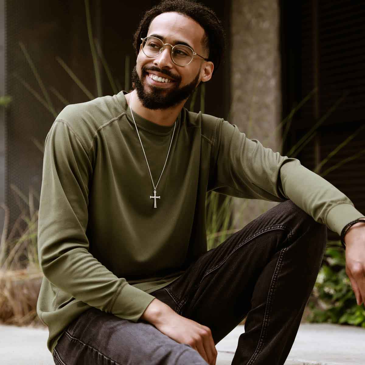 man wearing a sterling silver Chosen Cross Necklace