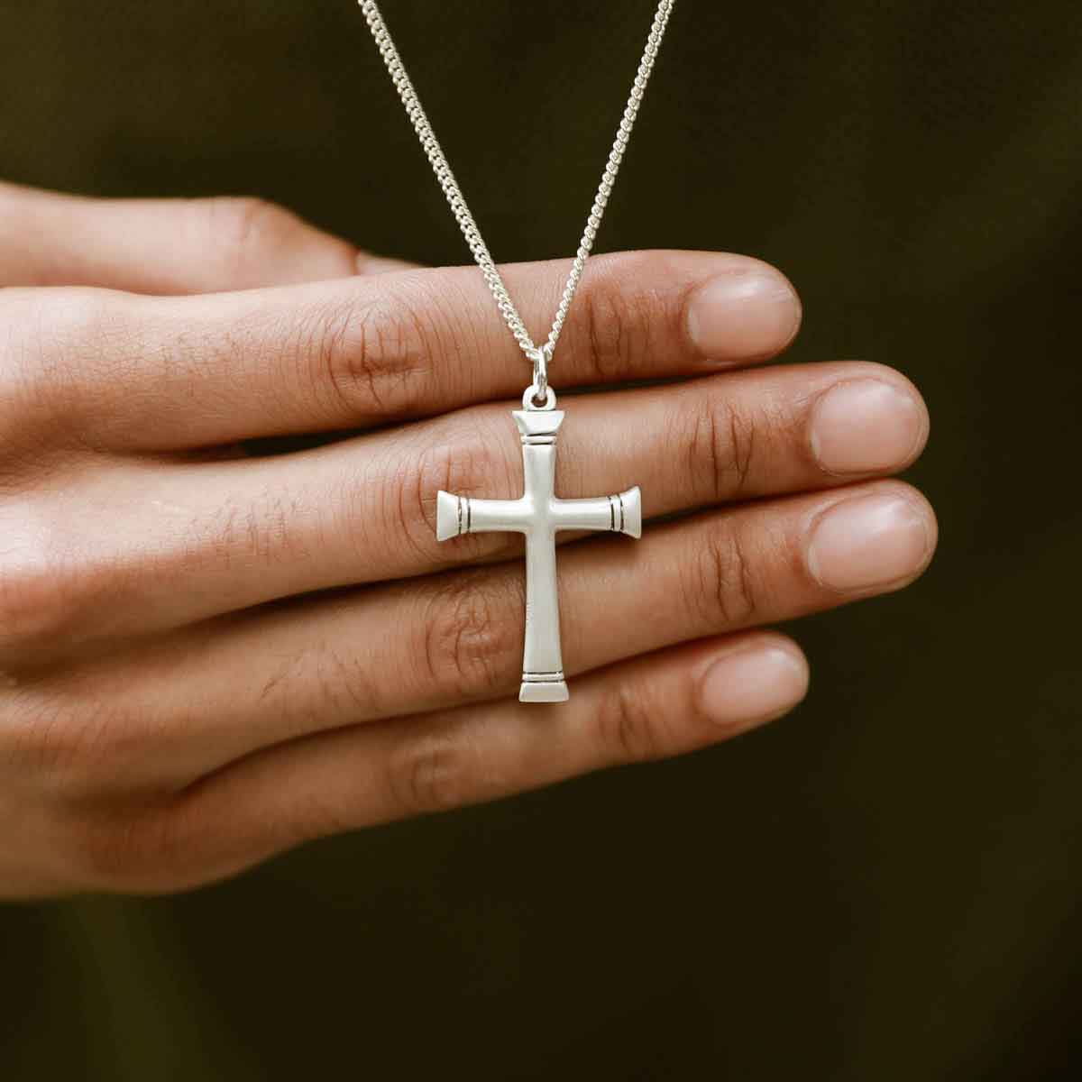 man wearing a sterling silver Chosen Cross Necklace