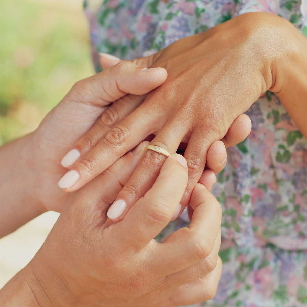 Girl wearing Classic stacking ring hand-molded and cast in 14k yellow gold with a 2mm birthstone or diamond with her husband