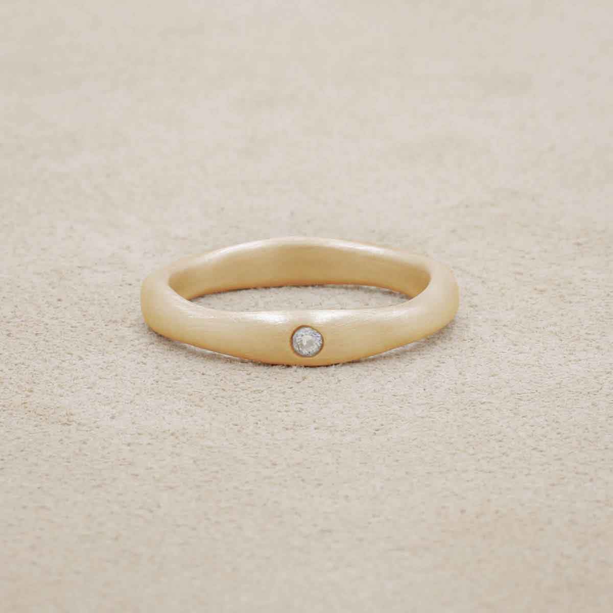 Classic stacking ring hand-molded and cast in 10k yellow gold with a 2mm birthstone or diamond 