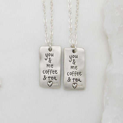 Coffee and tea necklace set handcrafted in sterling silver with a matte brushed finish with engravings to be connected and shared with someone