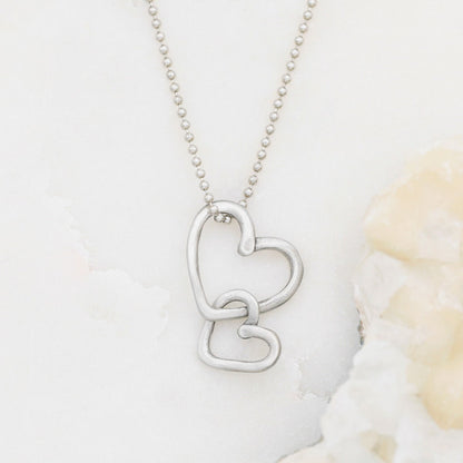 Connected hearts necklace handcrafted in pewter including a pair of heart charms