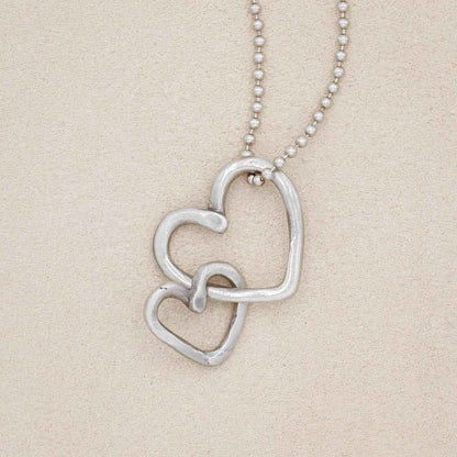 Connected hearts necklace handcrafted in pewter including a pair of heart charms