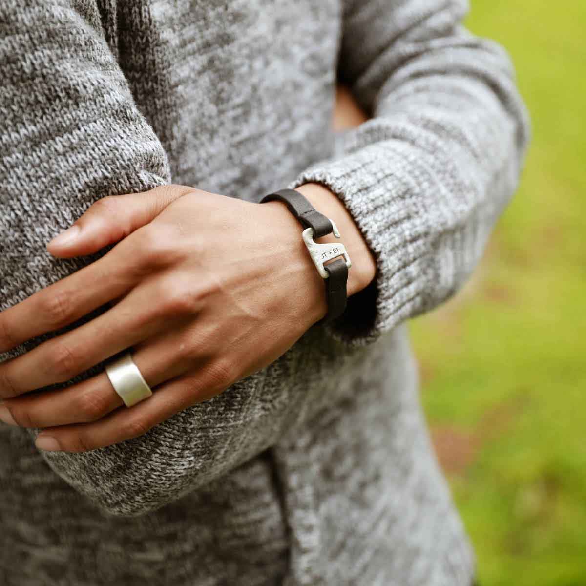 Black Connection bracelet handcrafted with a distressed black leather strap and a sterling silver closure customizable with a name