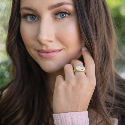 Girl wearing Constellation ring handcrafted in 10k yellow gold set with birthstones and crystal gemstones 