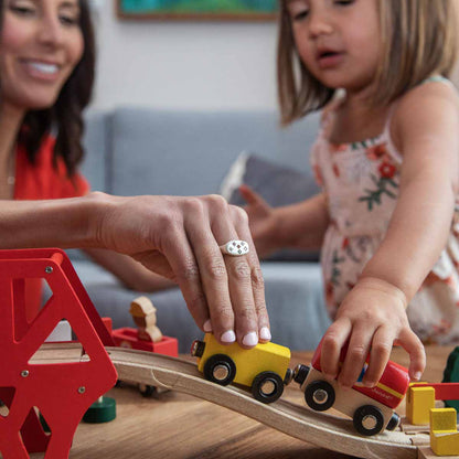 Mom wearing Constellation ring handcrafted in sterling silver set with birthstones and crystal gemstones and with her daughter