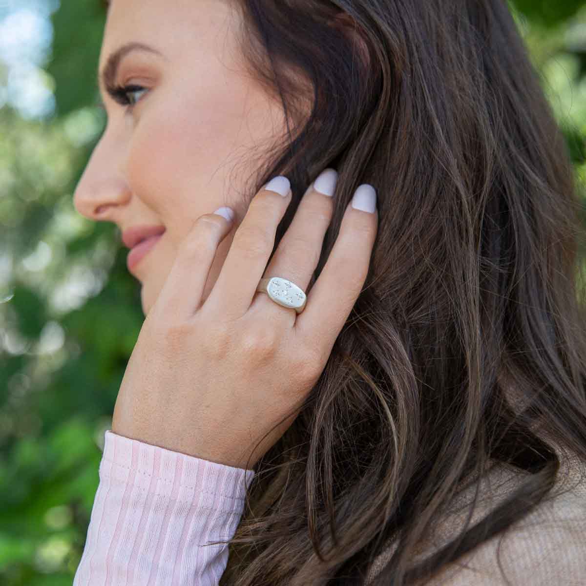 Girl wearing Constellation ring handcrafted in sterling silver set with birthstones and crystal gemstones 