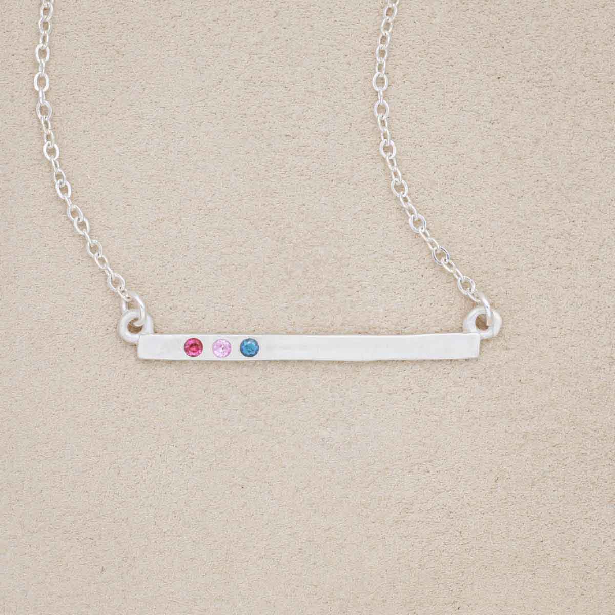 sterling silver cross bar birthstone necklace strung on a silver link chain customizable with up to 7 genuine 2mm birthstones