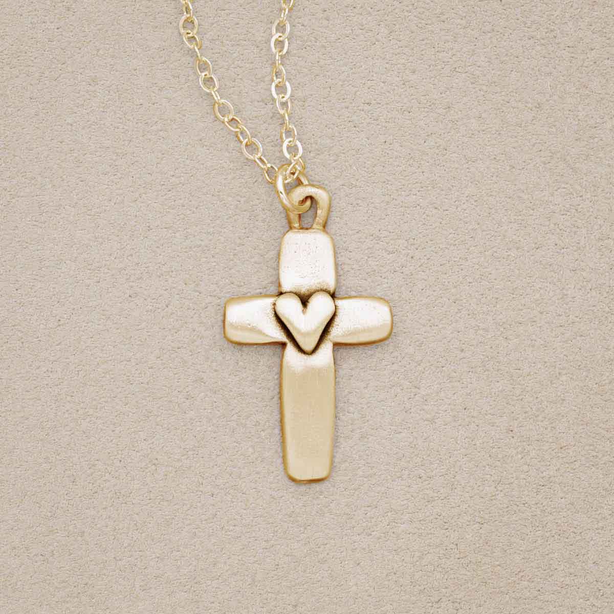 Handcrafted 14k yellow gold cross of faith necklace strung on a gold-filled link chain