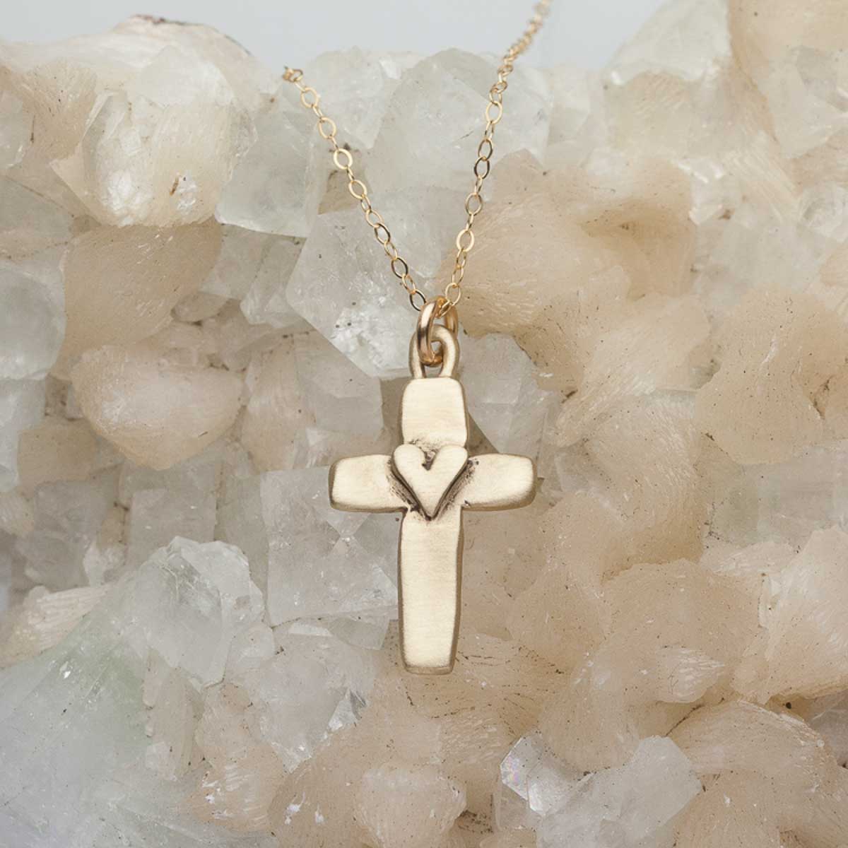 Handcrafted 14k yellow gold cross of faith necklace strung on a gold-filled link chain