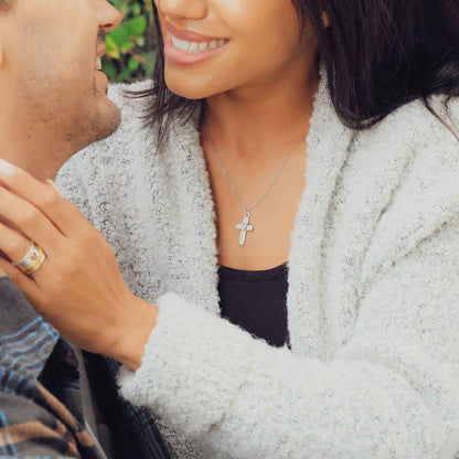 Woman wearing her Handcrafted sterling silver cross of faith necklace strung on a sterling silver link chain