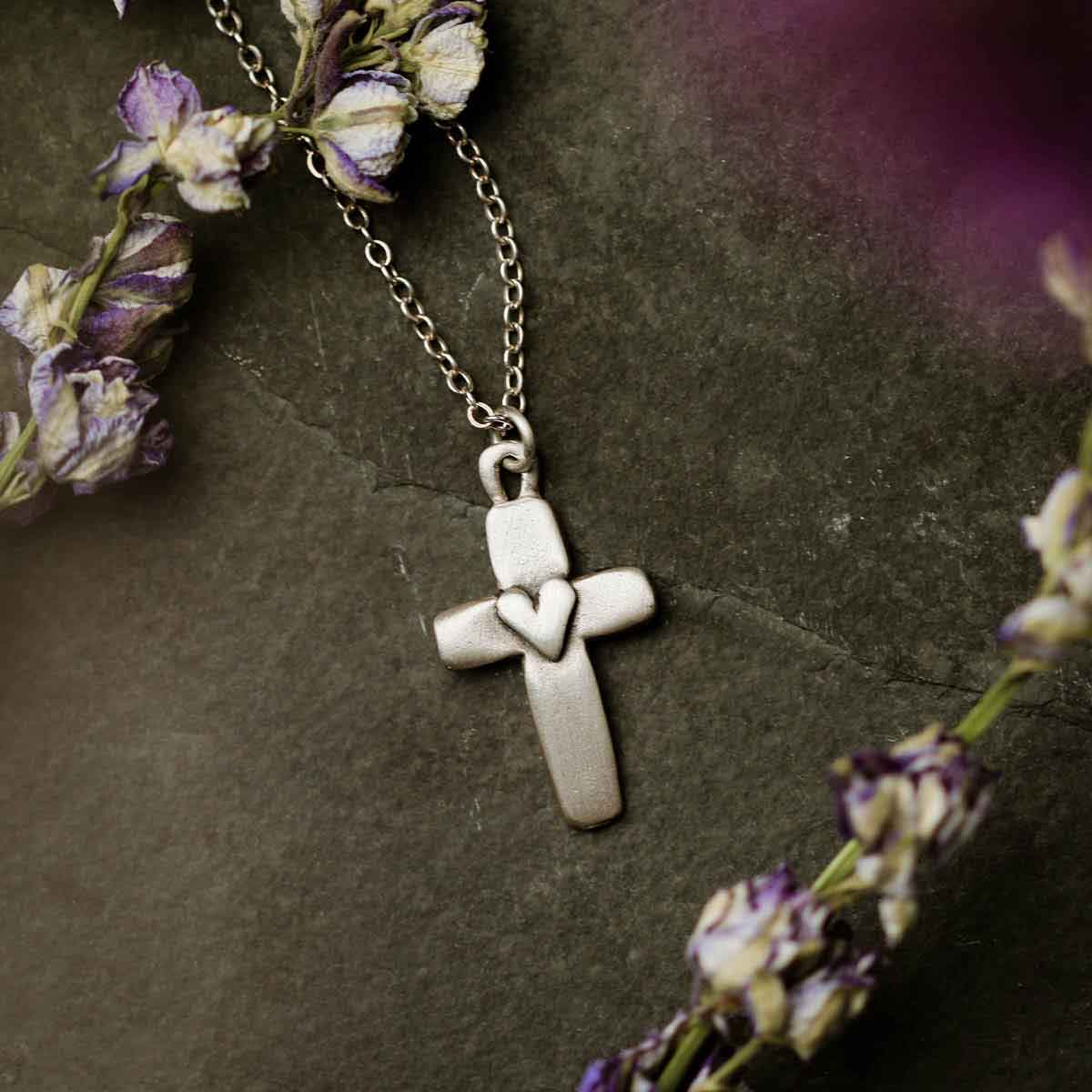 Handcrafted sterling silver cross of faith necklace strung on a sterling silver link chain