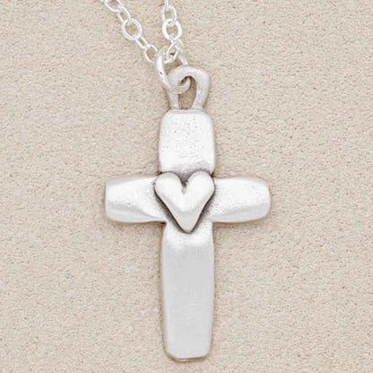 Handcrafted sterling silver cross of faith necklace with the word "faith" engraved on the back