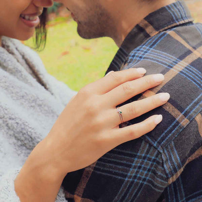 girl wearing pair of sterling silver Dainty finespun birthstone rings