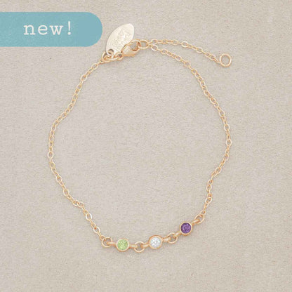 mom wearing 10k yellow gold Dainty Finespun Birthstone Bracelet - Medium personalized with 3mm birthstone