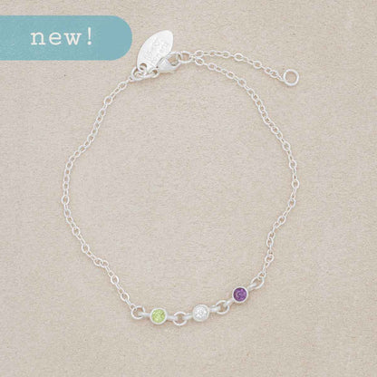 girl holding sterling silver Dainty Finespun Birthstone Bracelet - Medium