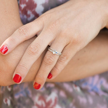 girl wearing her pair of sterling silver Dainty finespun birthstone ring with a genuine birthstone or conflict free diamond