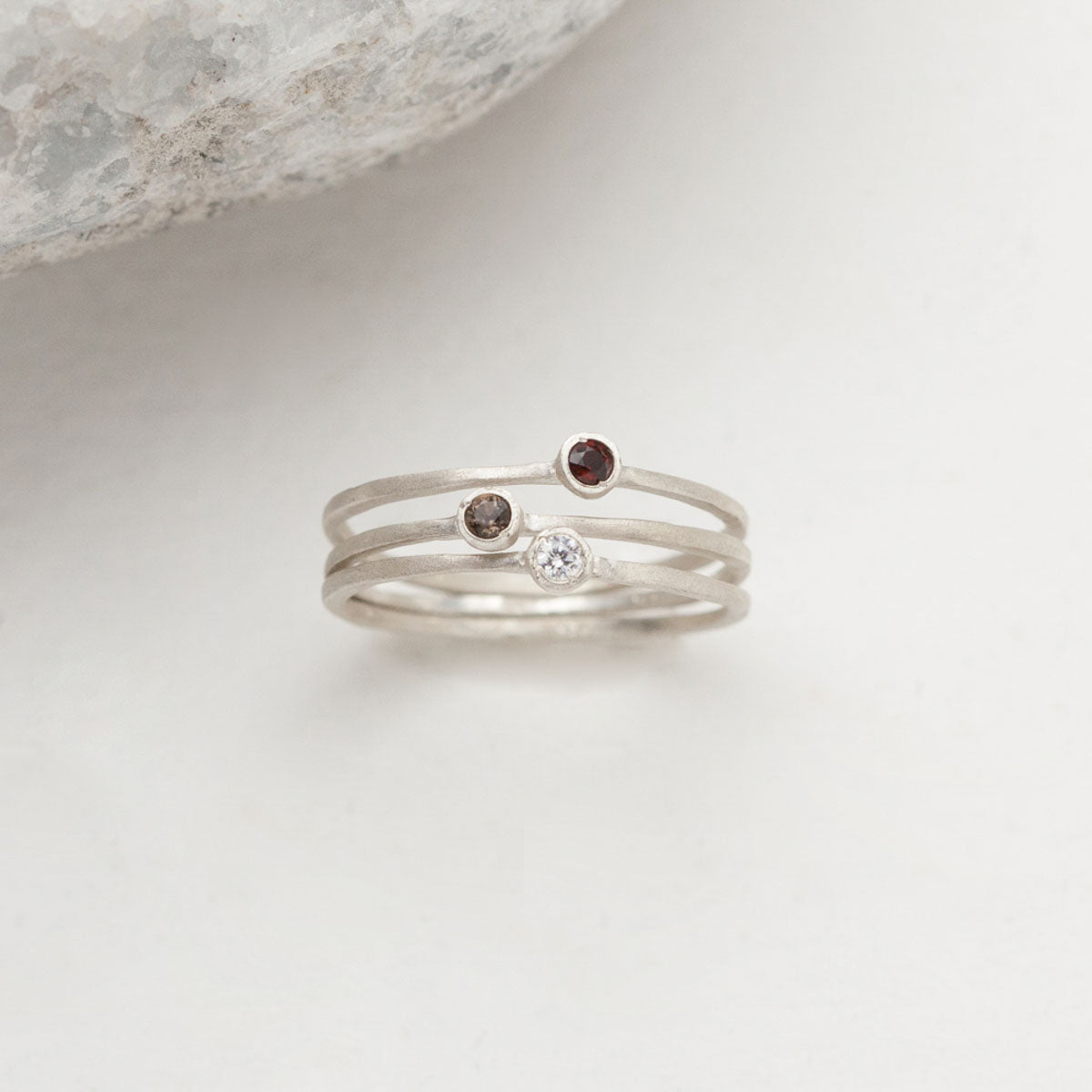 Dainty finespun ring trio handcrafted in sterling silver set with 3 birthstones