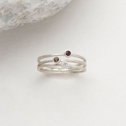 Dainty finespun ring trio handcrafted in sterling silver set with 3 birthstones