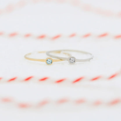 sterling silver and yellow gold dainty finespun birthstone rings with striped ribbon