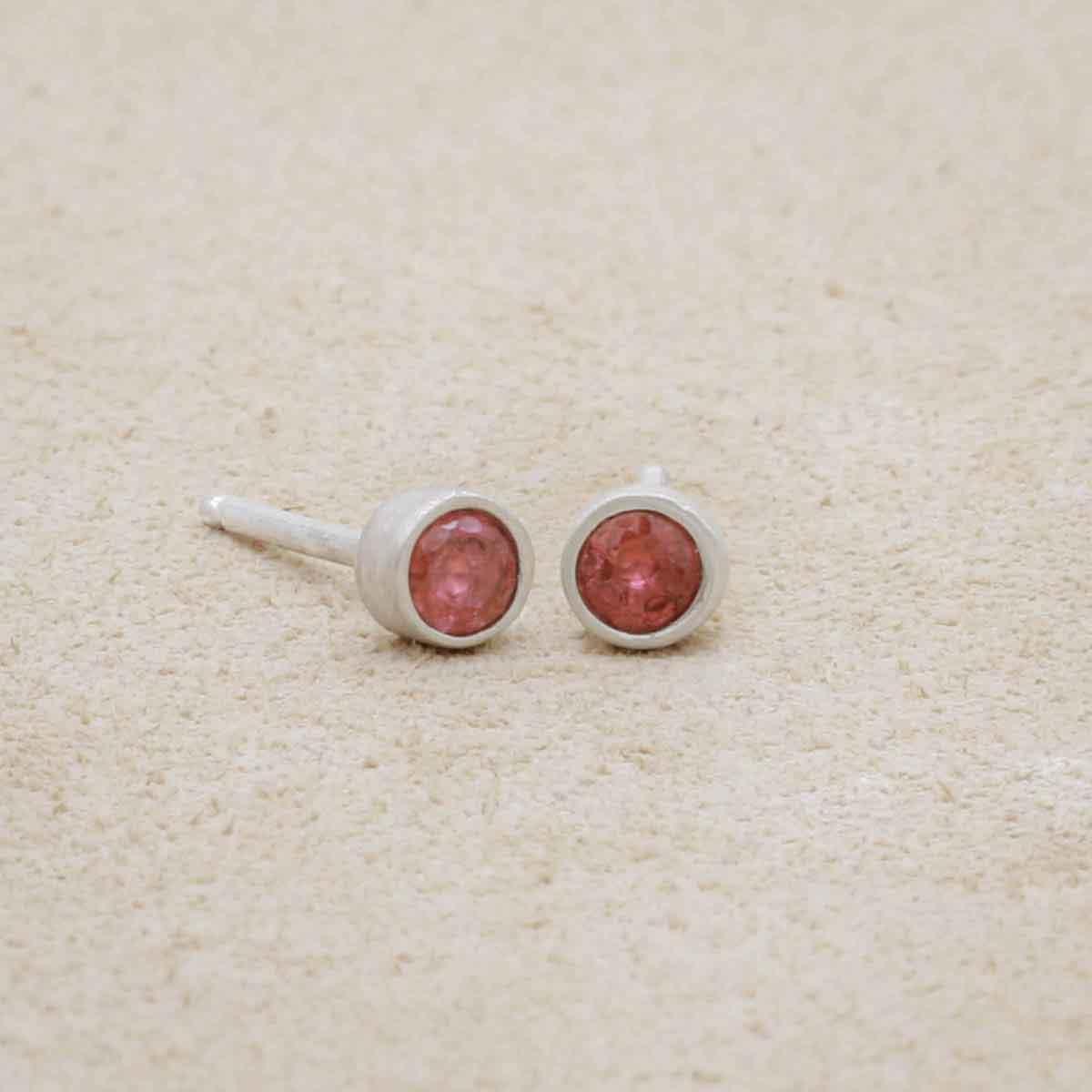 3mm Dainty Finespun Birthstone Stud Earrings - Medium in sterling silver, on a beige background