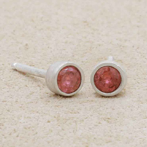 girl holding 3mm Dainty Finespun Birthstone Stud Earrings - Medium in sterling silver