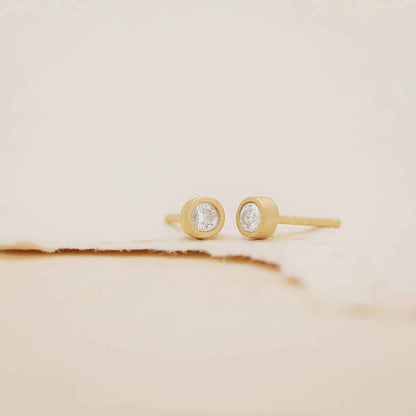 10k yellow gold Dainty Finespun Birthstone Stud Earrings - Medium 3mm on paper background