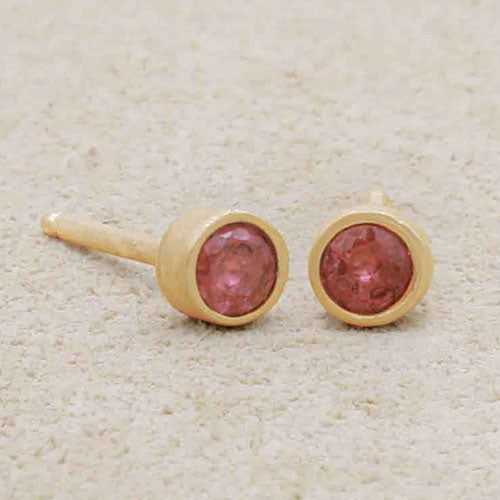 10k yellow gold Dainty Finespun Birthstone Stud Earrings - Medium 3mm on beige background