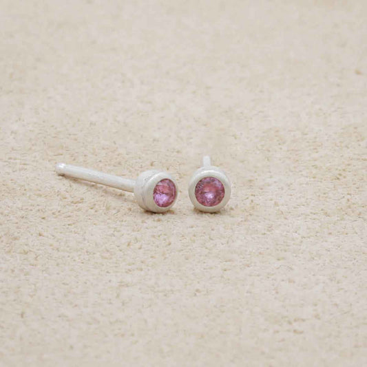 Dainty Finespun Birthstone Stud Earrings - Small in sterling silver on a beige background