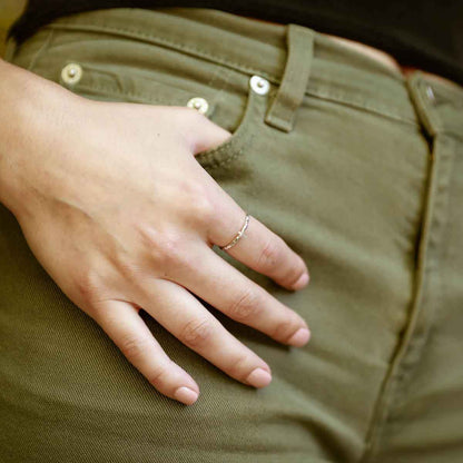 woman wearing a sterling silver Dainty Rugged Cross Ring