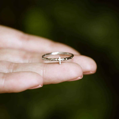 woman wearing a sterling silver Dainty Rugged Cross Ring