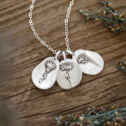 girl wearing a sterling silver December birth flower necklace