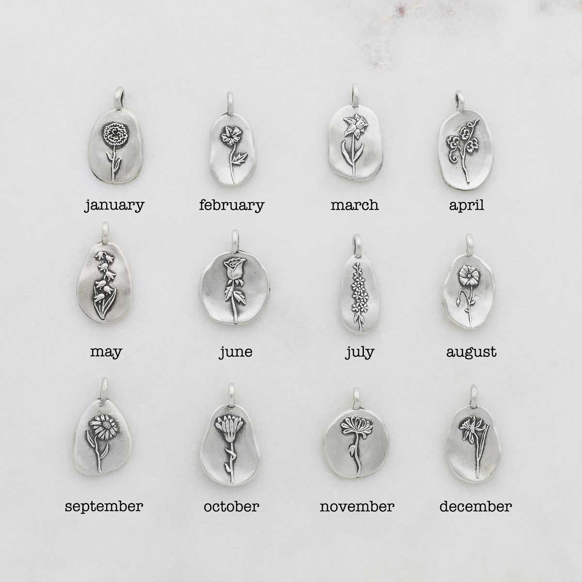 birth flower charms handcrafted in sterling silver with a special birth month charm strung with a vintage freshwater pearl