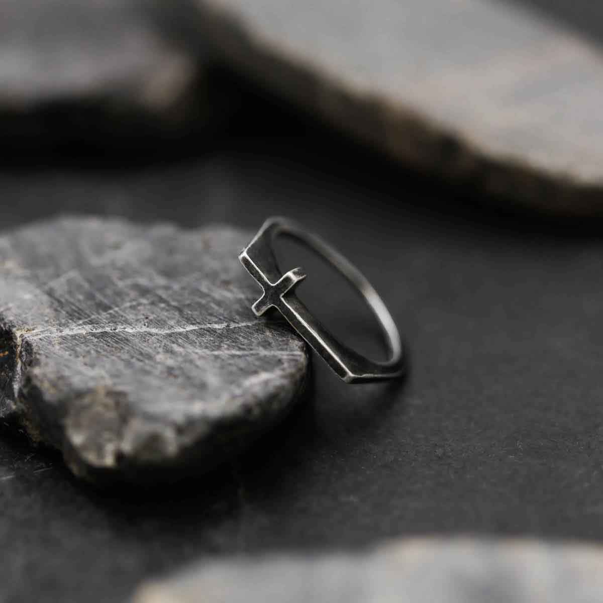 woman wearing a blackened sterling silver Dimensions Cross Ring