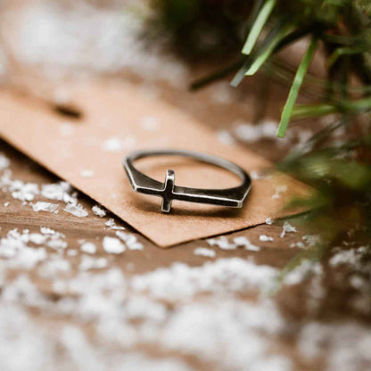 woman wearing a blackened sterling silver Dimensions Cross Ring