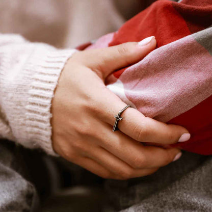 woman wearing a blackened sterling silver Dimensions Cross Ring