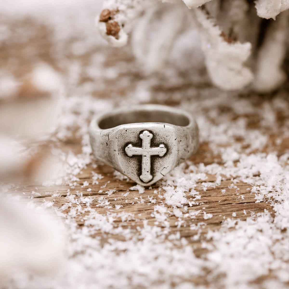 Man wearing Faith Hope and Love Cross Signet ring handcrafted in sterling silver with an antiqued finish