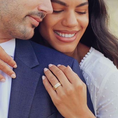 Girl wearing her Faith Hope and Love ring hand-molded in 10k yellow gold set with a 3mm birthstone or diamond and two 2mm stones on the sides with her husband