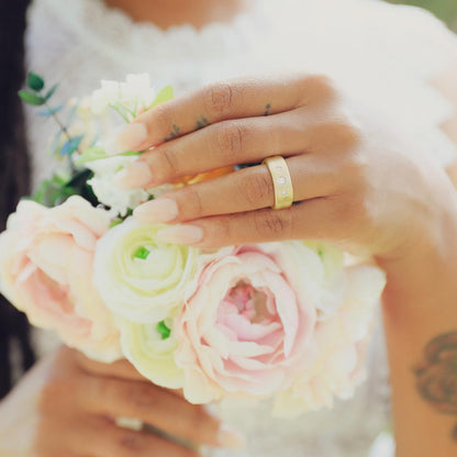 Girl wearing her Faith Hope and Love ring hand-molded in 10k yellow gold set with a 3mm birthstone or diamond and two 2mm stones on the sides 