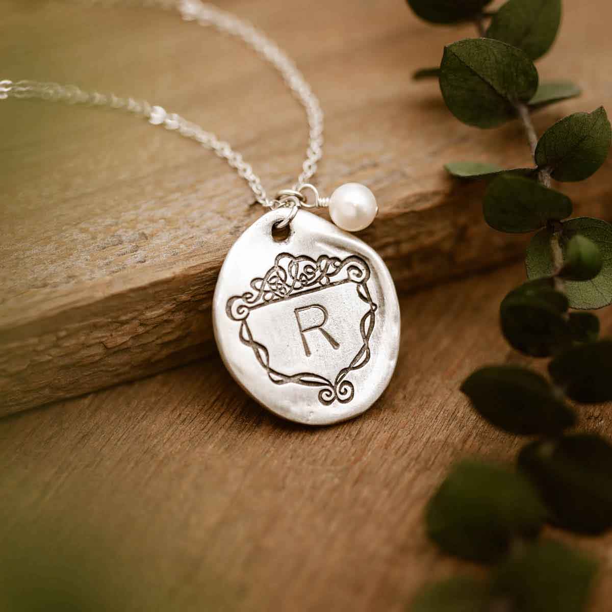  customized with an initial and includes a freshwater pearl