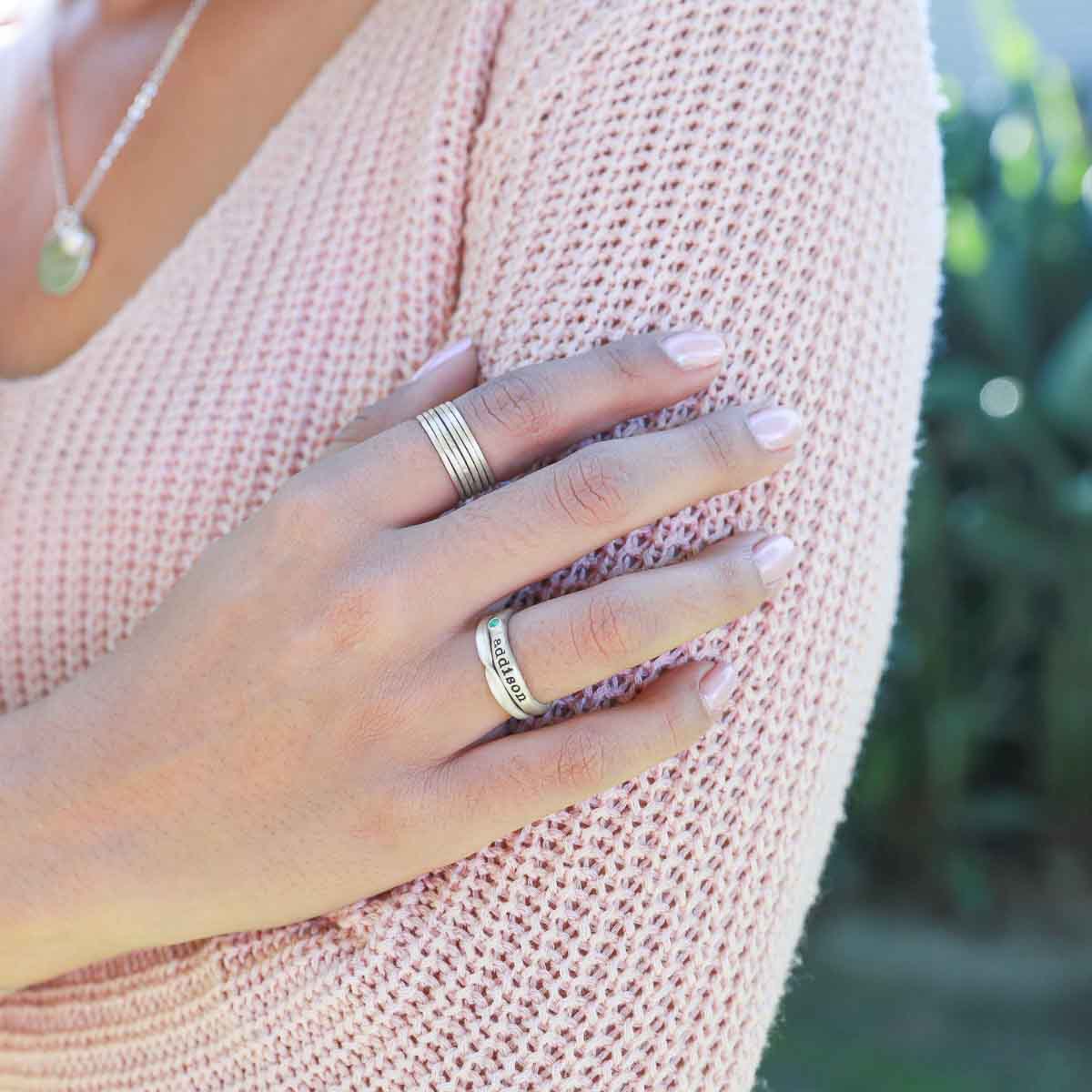 Girl wearing Featherweight stacking rings with 3 stackable ring handcrafted in sterling silver