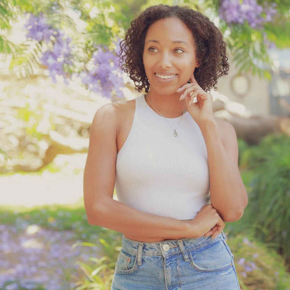 girl wearing a pewter February Birth Flower necklace with an 18" link chain