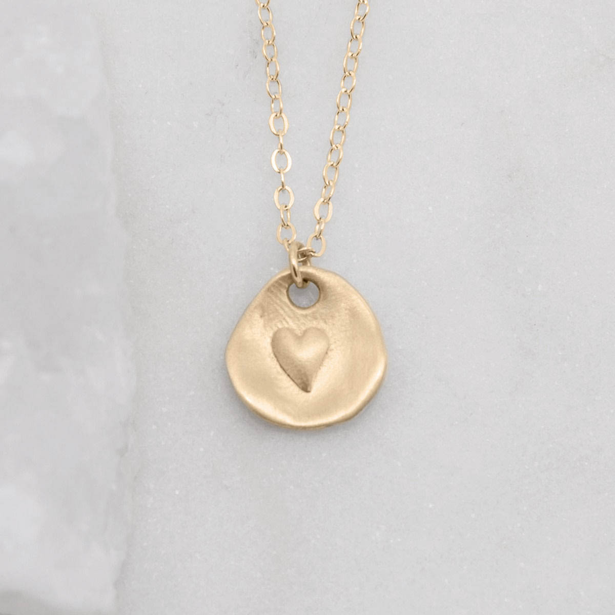 10k yellow gold full of love necklace strung on gold-filled link chain