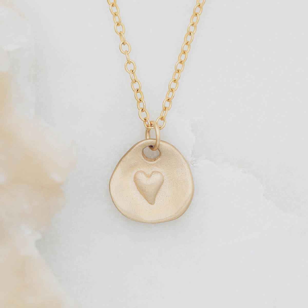 14k yellow gold full of love necklace strung on gold-filled link chain